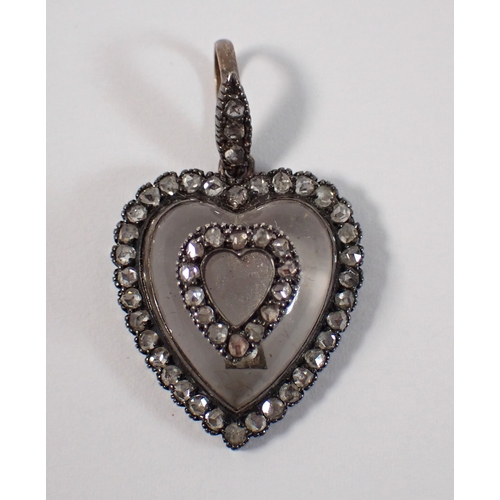 418 - An early 19th century carved rock crystal heart from pendant set old cut diamonds, 21mm x 19mm, 5g