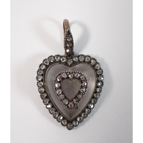 418 - An early 19th century carved rock crystal heart from pendant set old cut diamonds, 21mm x 19mm, 5g