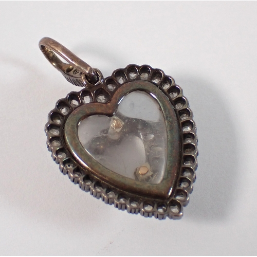 418 - An early 19th century carved rock crystal heart from pendant set old cut diamonds, 21mm x 19mm, 5g