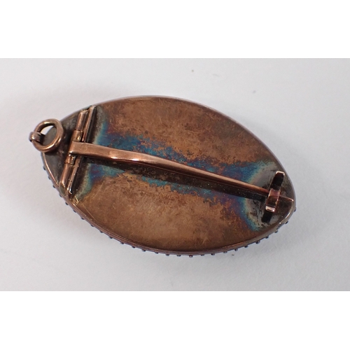 421 - A yellow metal mourning brooch / pendant within 28 diamond surround 3cm long