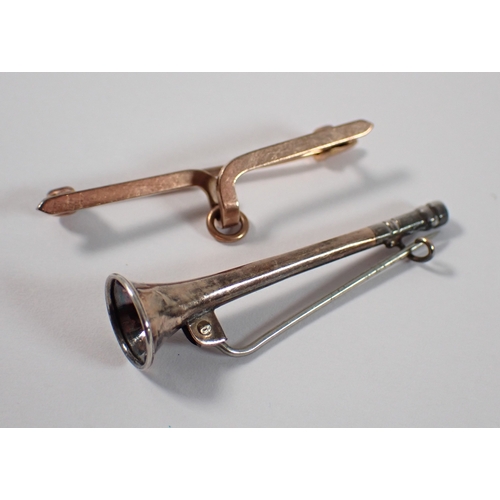 425 - A yellow metal pendant bar brooch and a yellow metal hanging horn form stick pin, 3g, 3.8cm long