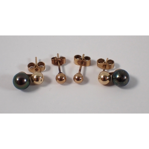 427 - A pair of 9ct gold stud and grey pearl earrings, plus a pair of 9ct gold ball stud earrings, total w... 