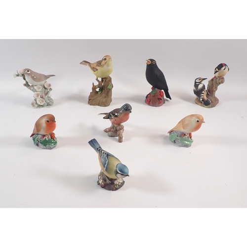 53 - A group of birds including Beswick Chaffinch, Lladro Robins initialled EJ etc. 7cm tall