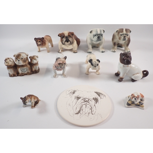 56 - A group of ceramic bulldog themed ornaments including one by Margaret Howard, tallest 11.5cm