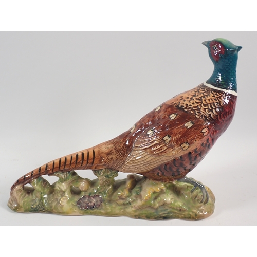 57 - A Beswick large fox and pheasant, 19cm tall