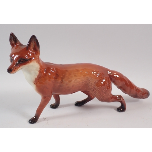 57 - A Beswick large fox and pheasant, 19cm tall