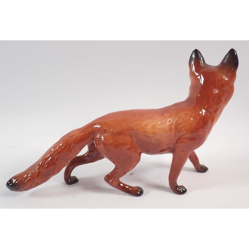 57 - A Beswick large fox and pheasant, 19cm tall