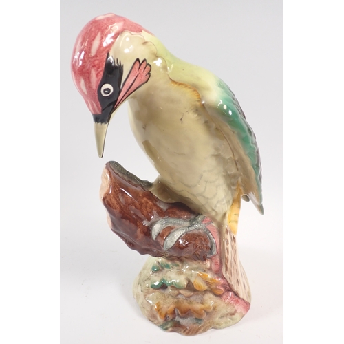 59 - A collection of Beswick birds including green woodpecker, two barn owls, cuckoo and thrush, 14cm tal... 