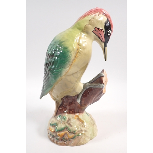 59 - A collection of Beswick birds including green woodpecker, two barn owls, cuckoo and thrush, 14cm tal... 