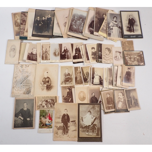 606 - A box of Victorian and later cabinet photographs and carte de visite including tennis play