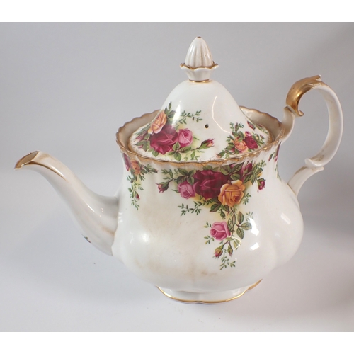9 - A Royal Albert Country Roses teapot, sugar, jug, seven saucers, five tea plates, an ashtray and a ca... 