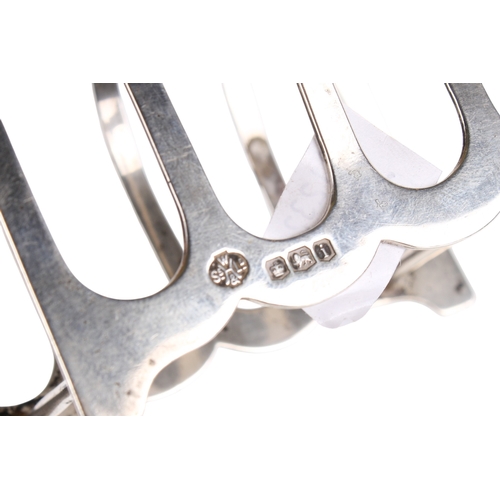 43 - A small group of silver and white metal table items. Comprising a set of six silver handled butter k... 