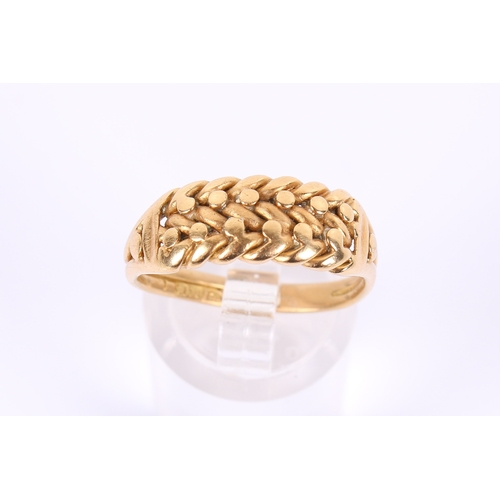 59 - An 18ct gold ring. With 'braided' centrepiece, hallmarked to shank. Misshapen size S, weight 5.5g.