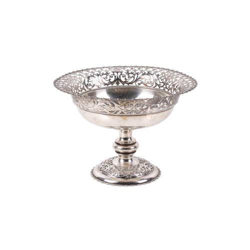 1 - An early 20th century silver pedestal bowl. The rim and foot with a pierced border of scrolls and le... 