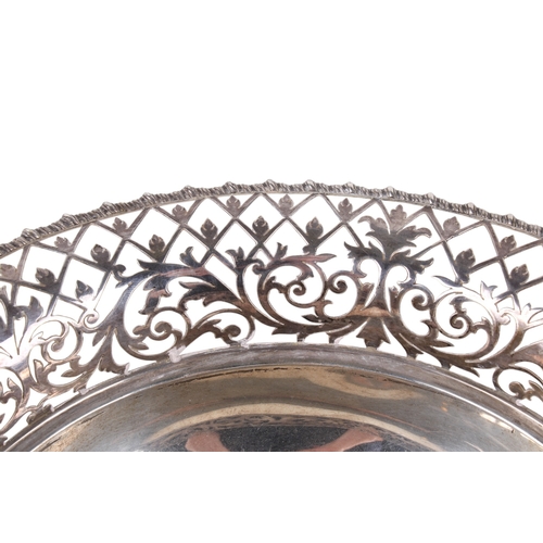 1 - An early 20th century silver pedestal bowl. The rim and foot with a pierced border of scrolls and le... 