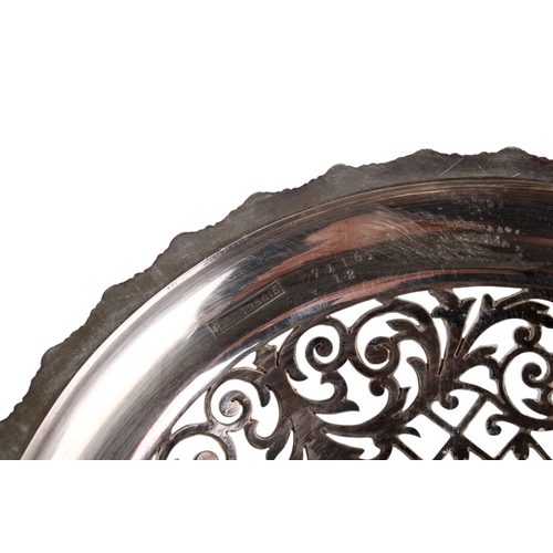 1 - An early 20th century silver pedestal bowl. The rim and foot with a pierced border of scrolls and le... 