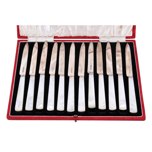 14 - A boxed set of twelve silver and mother of pearl fruit knives. Hallmarks for James Dixon & Sons Ltd,... 