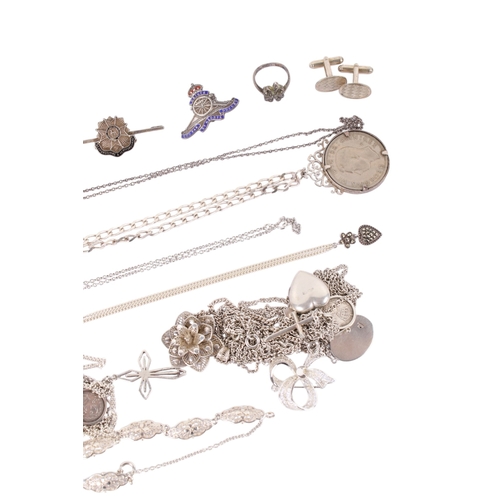183 - A group of silver and white metal jewellery. Including necklaces and pendants, a pomander, coin pend... 