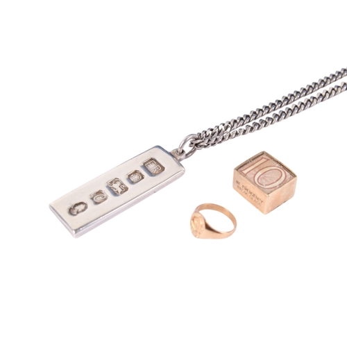 184 - Three pieces of gold and silver jewellery. Comprising a hallmarked 9ct gold ten shilling note charm,... 