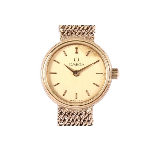 196 - A 9ct gold lady's Omega wristwatch. With gilt markers to the round gold face, case diameter 1.8cm, c... 