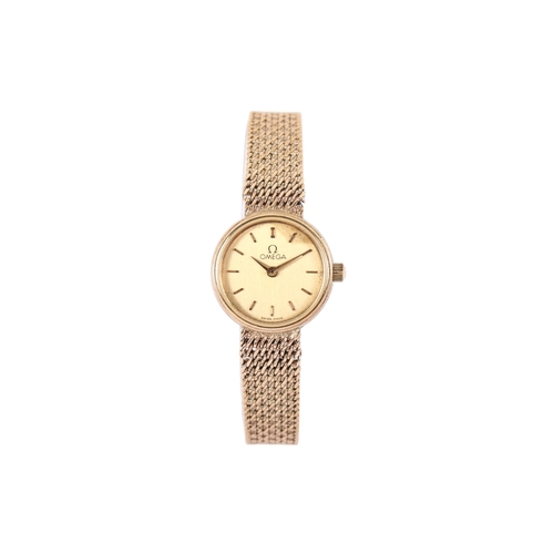 196 - A 9ct gold lady's Omega wristwatch. With gilt markers to the round gold face, case diameter 1.8cm, c... 