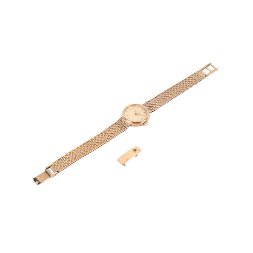 196 - A 9ct gold lady's Omega wristwatch. With gilt markers to the round gold face, case diameter 1.8cm, c... 