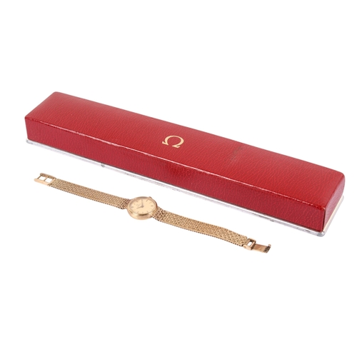 196 - A 9ct gold lady's Omega wristwatch. With gilt markers to the round gold face, case diameter 1.8cm, c... 