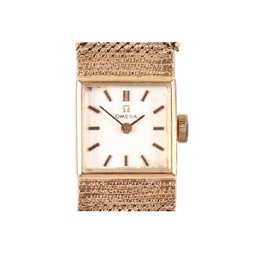 197 - A 9ct gold lady's Omega wristwatch. Gilt markers to the square champagne face, hallmarks to the clas... 