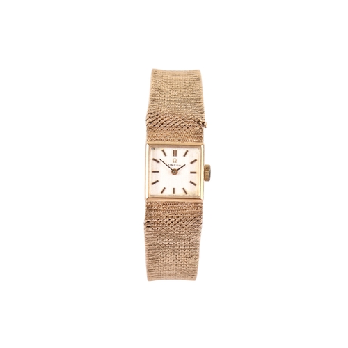 197 - A 9ct gold lady's Omega wristwatch. Gilt markers to the square champagne face, hallmarks to the clas... 