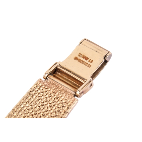 197 - A 9ct gold lady's Omega wristwatch. Gilt markers to the square champagne face, hallmarks to the clas... 