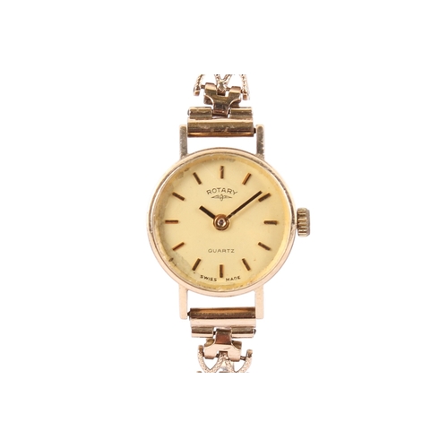 198 - A 9ct gold Rotary lady's quartz dress wristwatch. With gilt markers to the champagne face, hallmarke... 