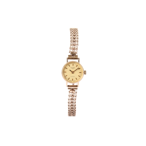 198 - A 9ct gold Rotary lady's quartz dress wristwatch. With gilt markers to the champagne face, hallmarke... 