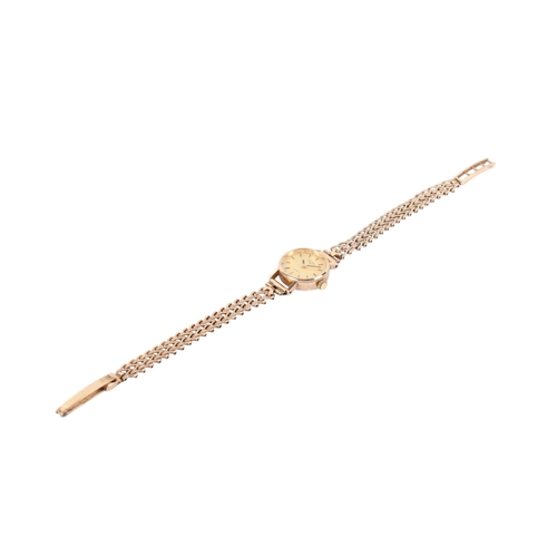 198 - A 9ct gold Rotary lady's quartz dress wristwatch. With gilt markers to the champagne face, hallmarke... 
