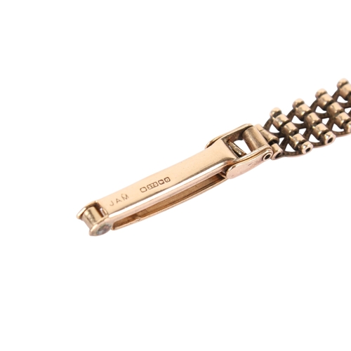 198 - A 9ct gold Rotary lady's quartz dress wristwatch. With gilt markers to the champagne face, hallmarke... 