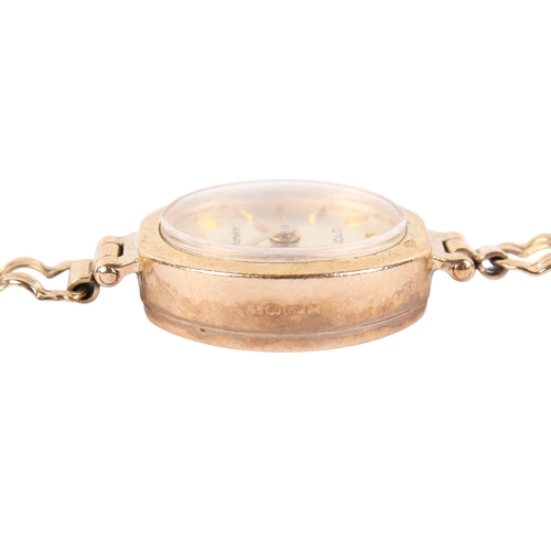 199 - A 9ct gold lady's Geneve Gold quartz dress watch. Gilt markers to the champagne face, hallmarks to s... 