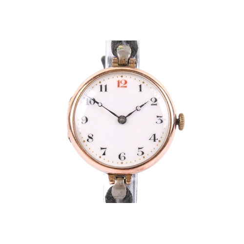 202 - A 9ct gold cased wristwatch. With black and red Arabic numerals to  the white face, hallmarks to fro... 