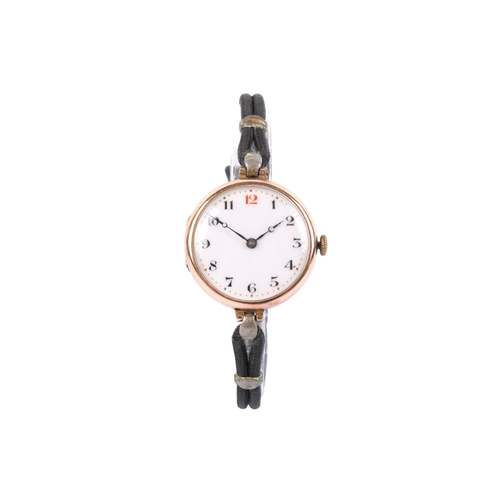 202 - A 9ct gold cased wristwatch. With black and red Arabic numerals to  the white face, hallmarks to fro... 