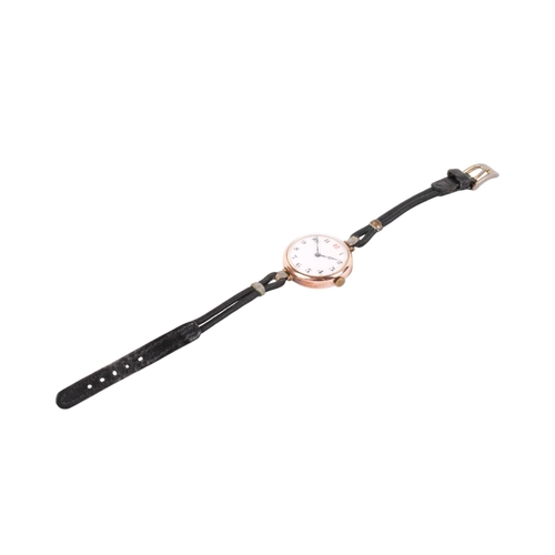 202 - A 9ct gold cased wristwatch. With black and red Arabic numerals to  the white face, hallmarks to fro... 