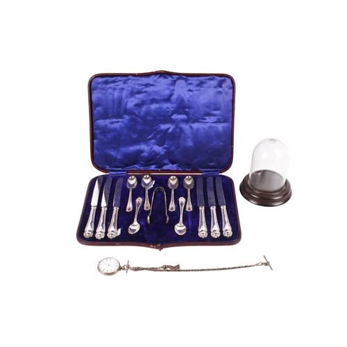 232 - A set of silver handled butter knives and teaspoons and a silver pocket watch. The flatware comprisi... 