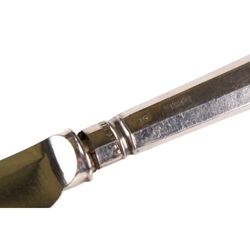 43 - A small group of silver and white metal table items. Comprising a set of six silver handled butter k... 