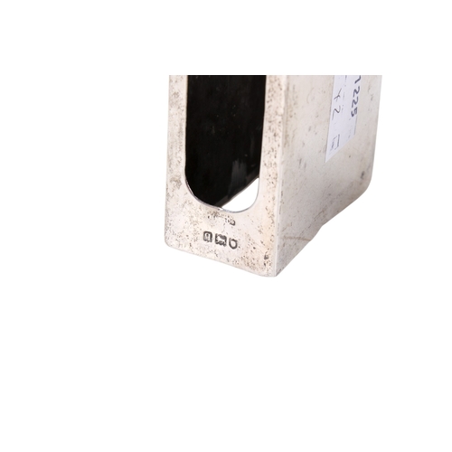 47 - A silver matchbox cover and a pepper pot. The cover with engraved sun ray pattern, hallmarks for Lon... 