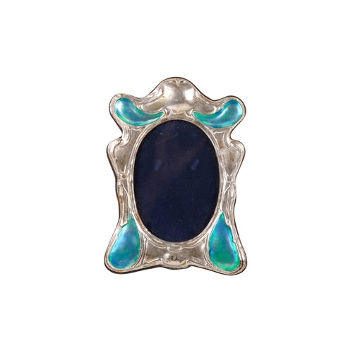 50 - An Art Nouveau style silver mirror. Of organic flowing form, four raised sections with transparent t... 