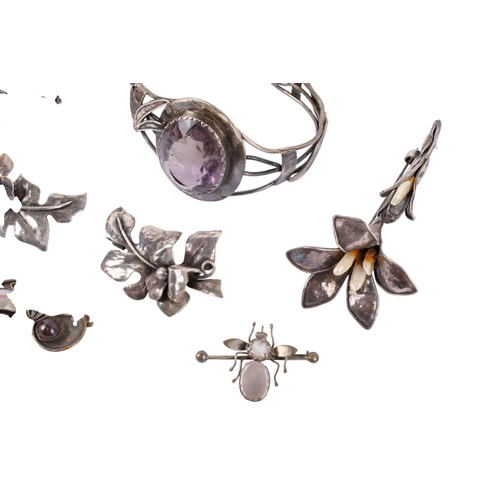 248 - A collection of white metal and stone set jewellery. Comprising six brooches in the form of flowers ... 