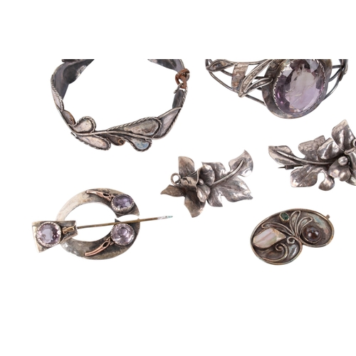 248 - A collection of white metal and stone set jewellery. Comprising six brooches in the form of flowers ... 