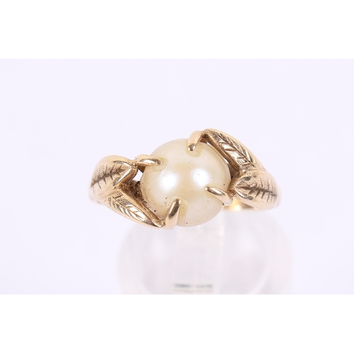 254 - A 9ct gold and pearl dress ring. The pearl of circa 8mm diameter, with a flattened base, in a hallma... 