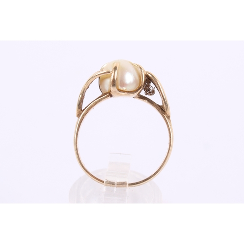 254 - A 9ct gold and pearl dress ring. The pearl of circa 8mm diameter, with a flattened base, in a hallma... 