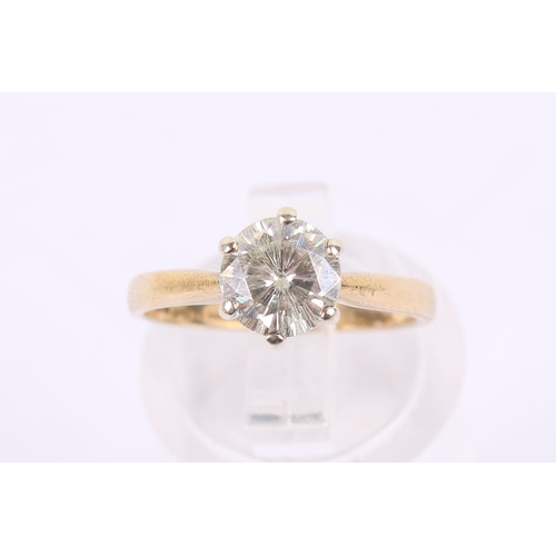 258 - A 9ct gold and moisannite ring. The stone of circa 7mm diameter, teh shank hallmarked, size J, gross... 