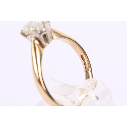 258 - A 9ct gold and moisannite ring. The stone of circa 7mm diameter, teh shank hallmarked, size J, gross... 