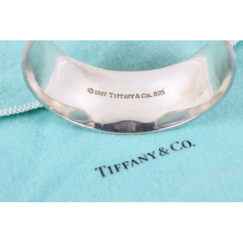 259 - A silver 1837 Tiffany style silver cuff. Marked 925 T&Co 1837 to the outside, and with copyright mar... 