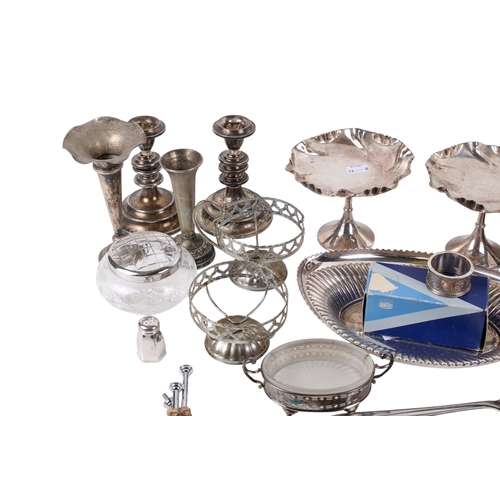 293 - A collection of silverplated table items. Including candlesticks, a boxed egg and spoon set, dishes,... 